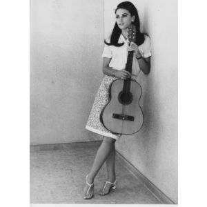 The Italian Actress Nicoletta Machiavelli with a guitar