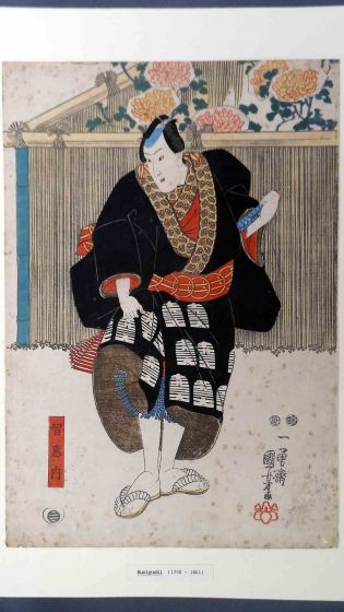 Theater Actor in Black Coat on Stage