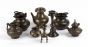 Set of Eight Copper Alloy Containers, One with a Spoon 